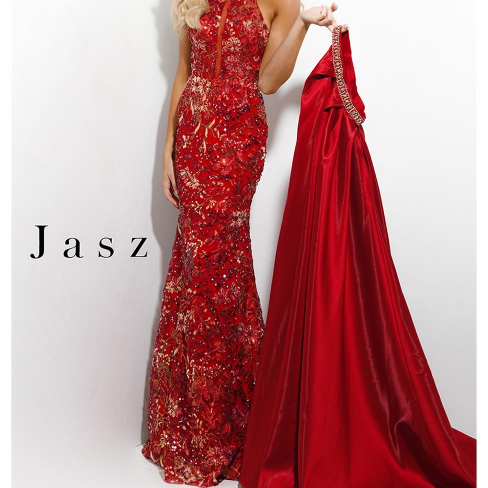 Jasz Couture - 7316 Embellished Halter
Neckline With Waist Cape Gown
